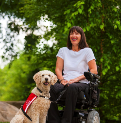 Woman in a wheelchair with her Service Dog Guide