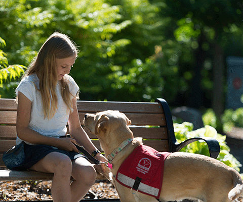 Young Girl with her Diabetic Alert Dog Guide