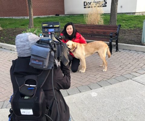 News reporter with Dog Guide
