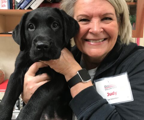 Volunteer hold puppy