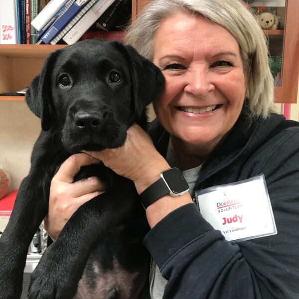 Volunteer hold puppy