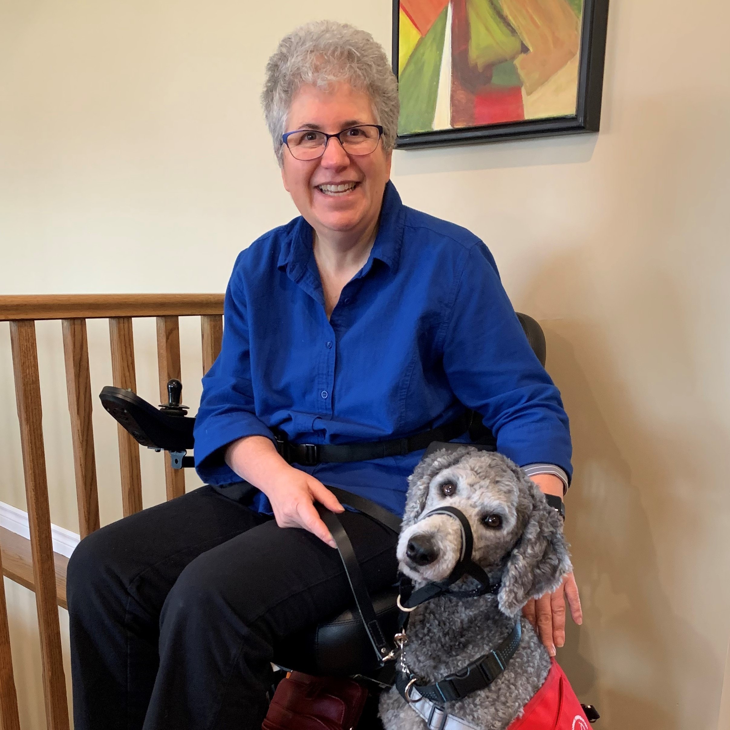 On a daily basis, Parade helps me prevent falls by reaching for items and helping clear pathways. She checks on me every morning when I get up and she waits patiently as I go about my daily care tasks waiting for opportunities to assist me. We have become a wonderful team. Parade is an amazing gift that keeps on giving. She has given me a renewed purpose as well as greater independence and confidence in my abilities. I am eternally thankful for Parade!